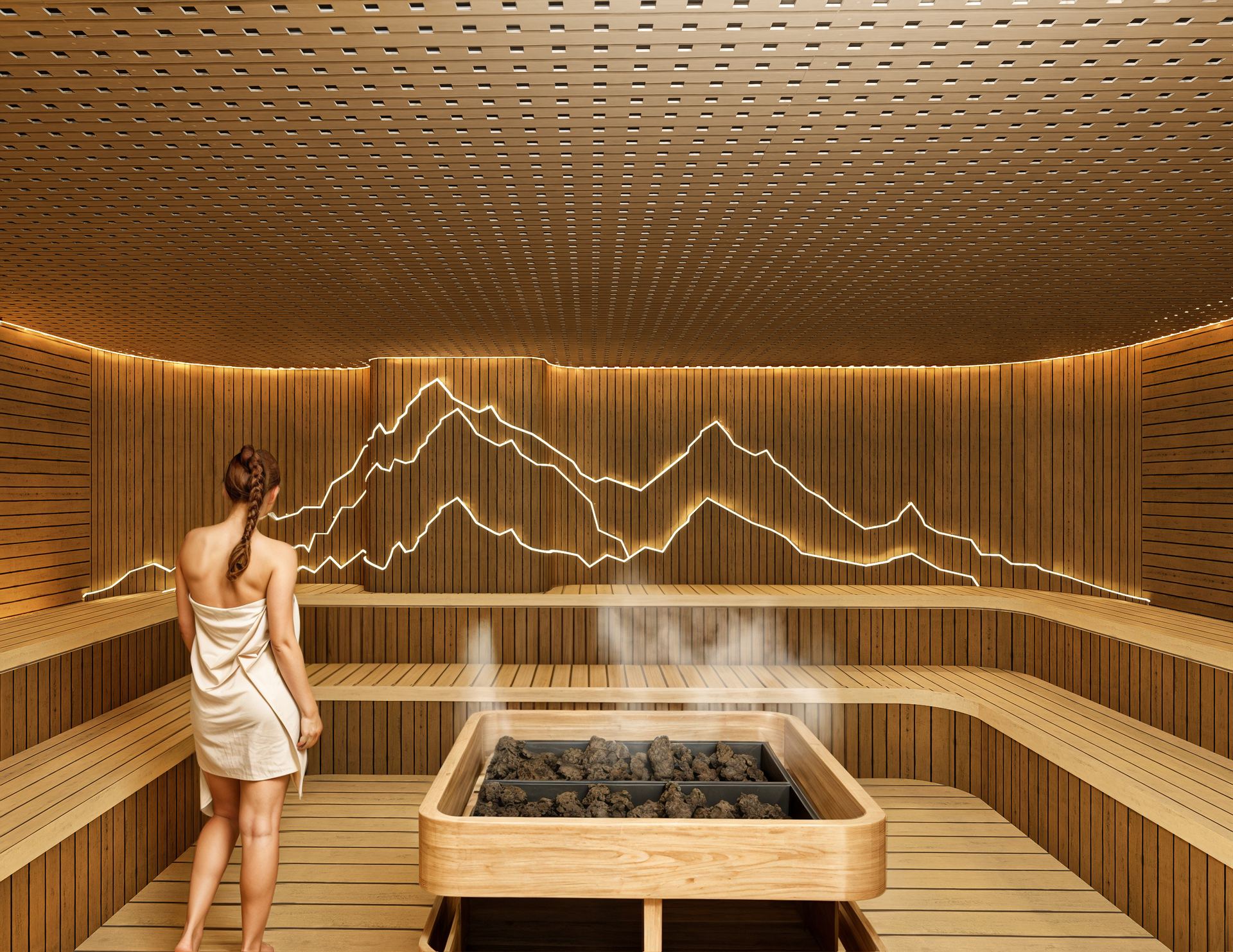 A guest in the Finnish sauna, beside the stove and a lit mountain relief